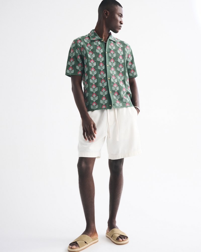 Polo estilo suéter abotonado y estilo croché floral
