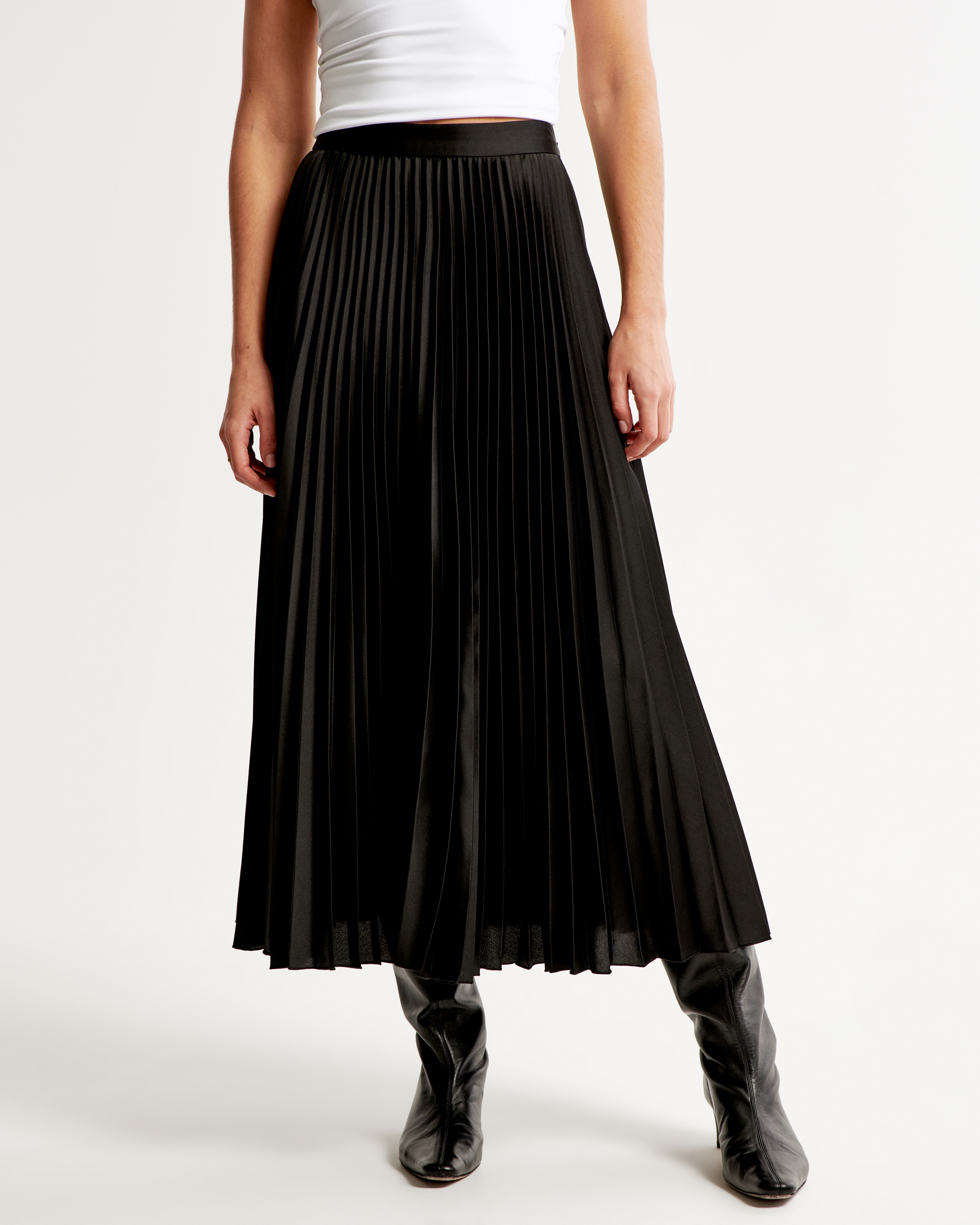 Black pleated midi 2025 skirt 7 little words