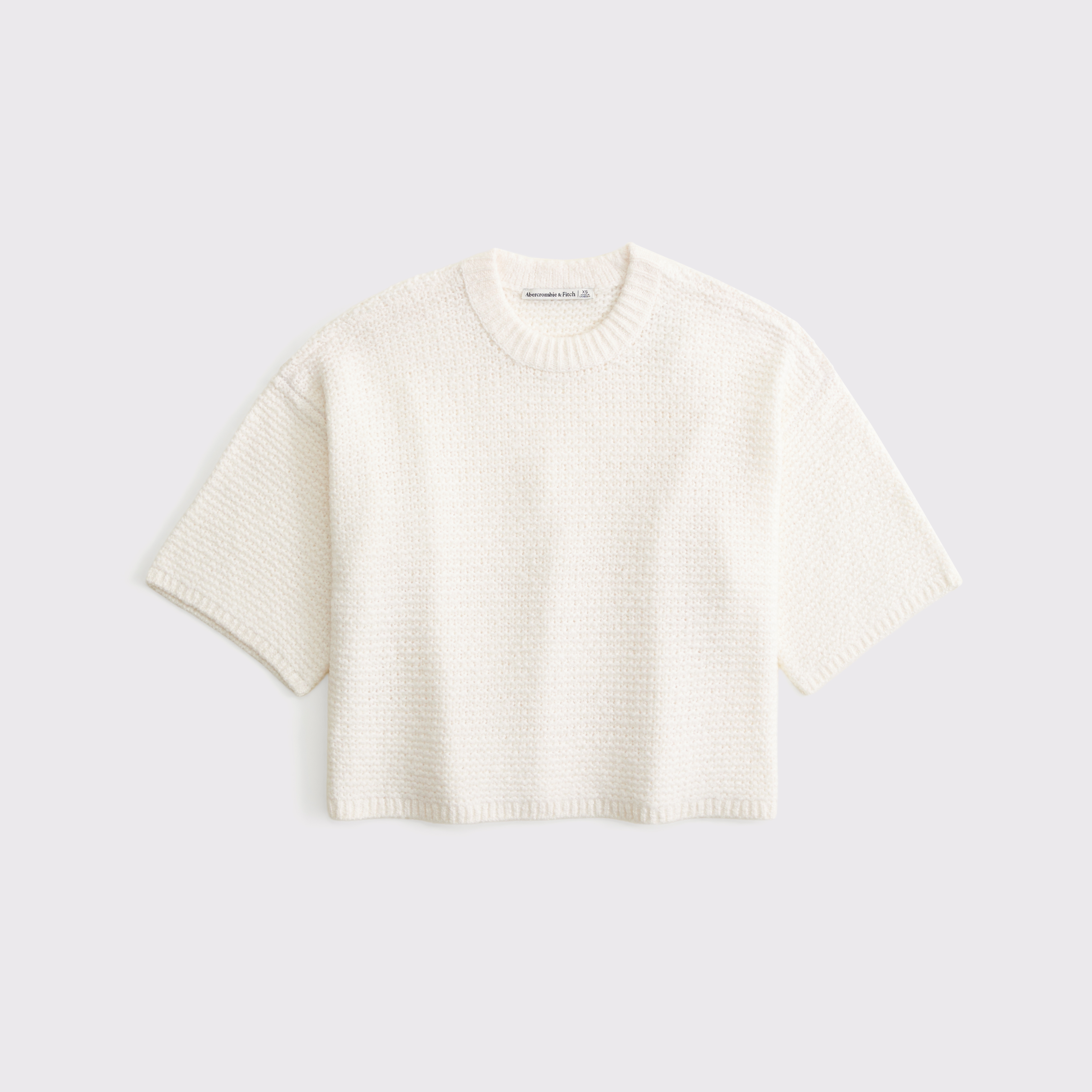 Женский свитер Abercrombie & Fitch Short-Sleeve Boxy Sweater Tee, цвет: Кремовый — фото 1
