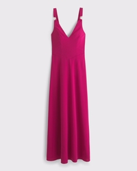 Vestito lungo con dettagli in metallo e vita scesa