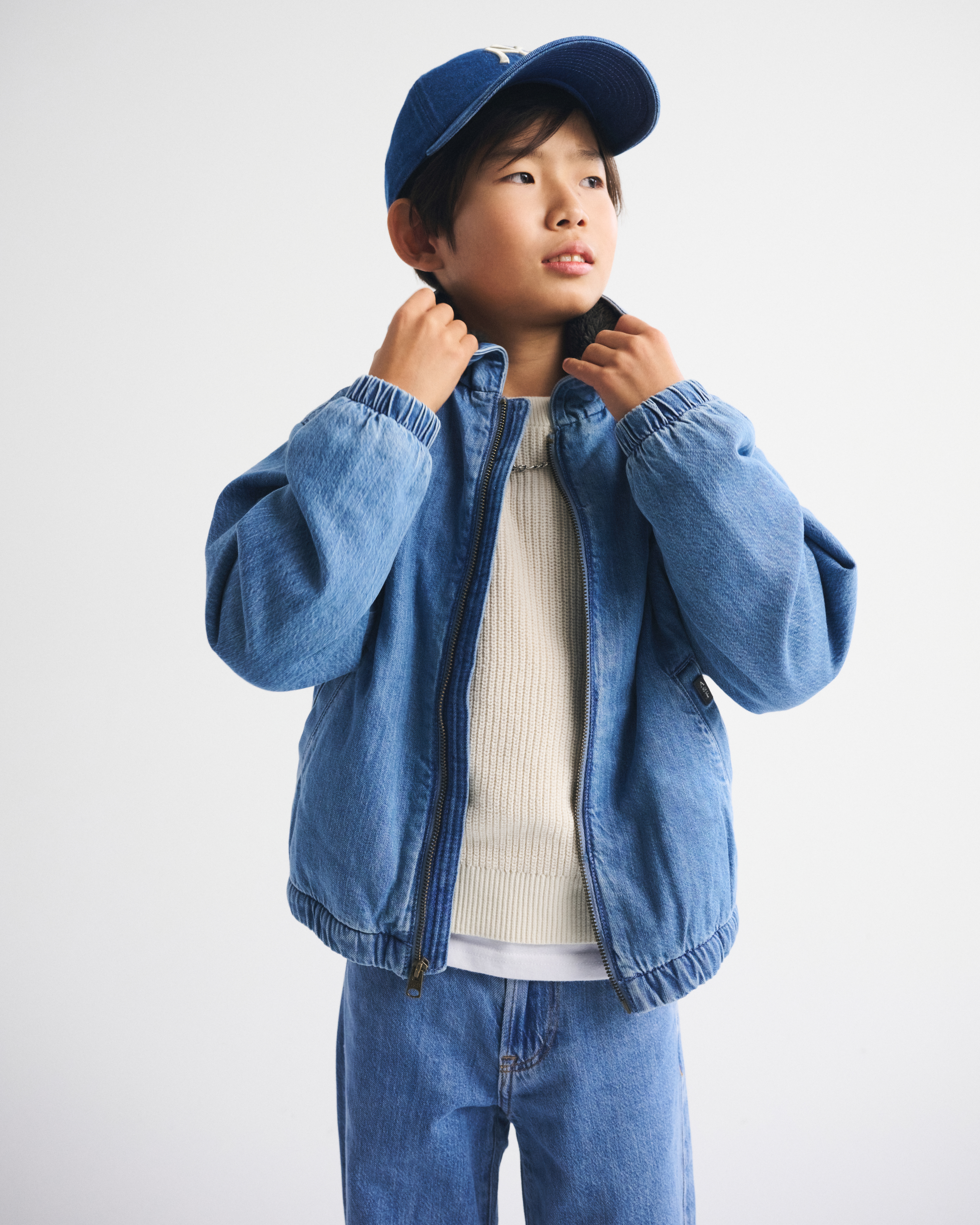 faux fur-lined denim hooded bomber jacket