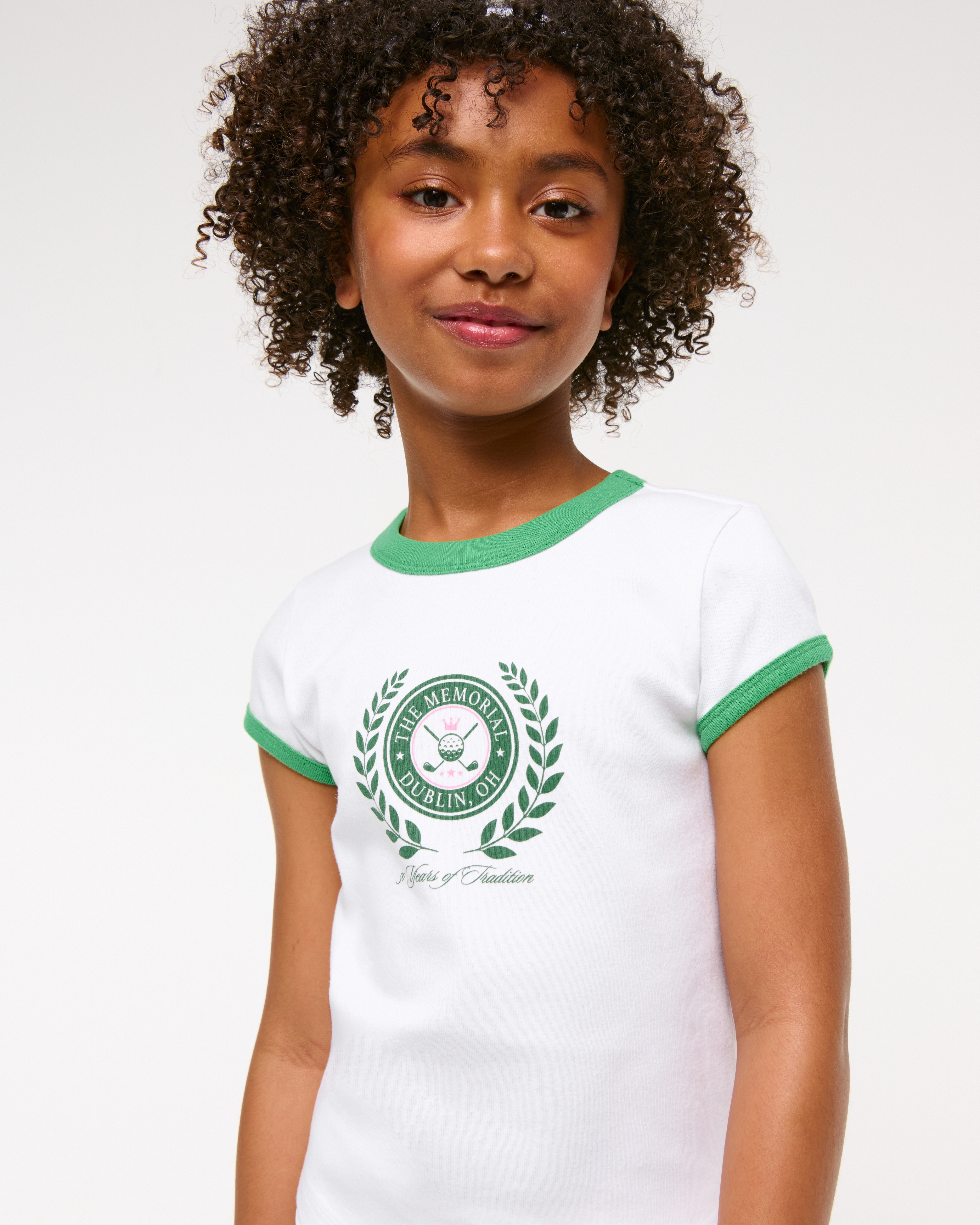 girls memorial tournament graphic baby tee | girls tops