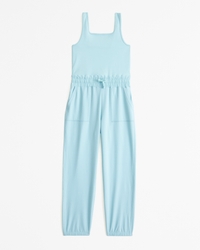 traveler mixed fabric parachute jumpsuit