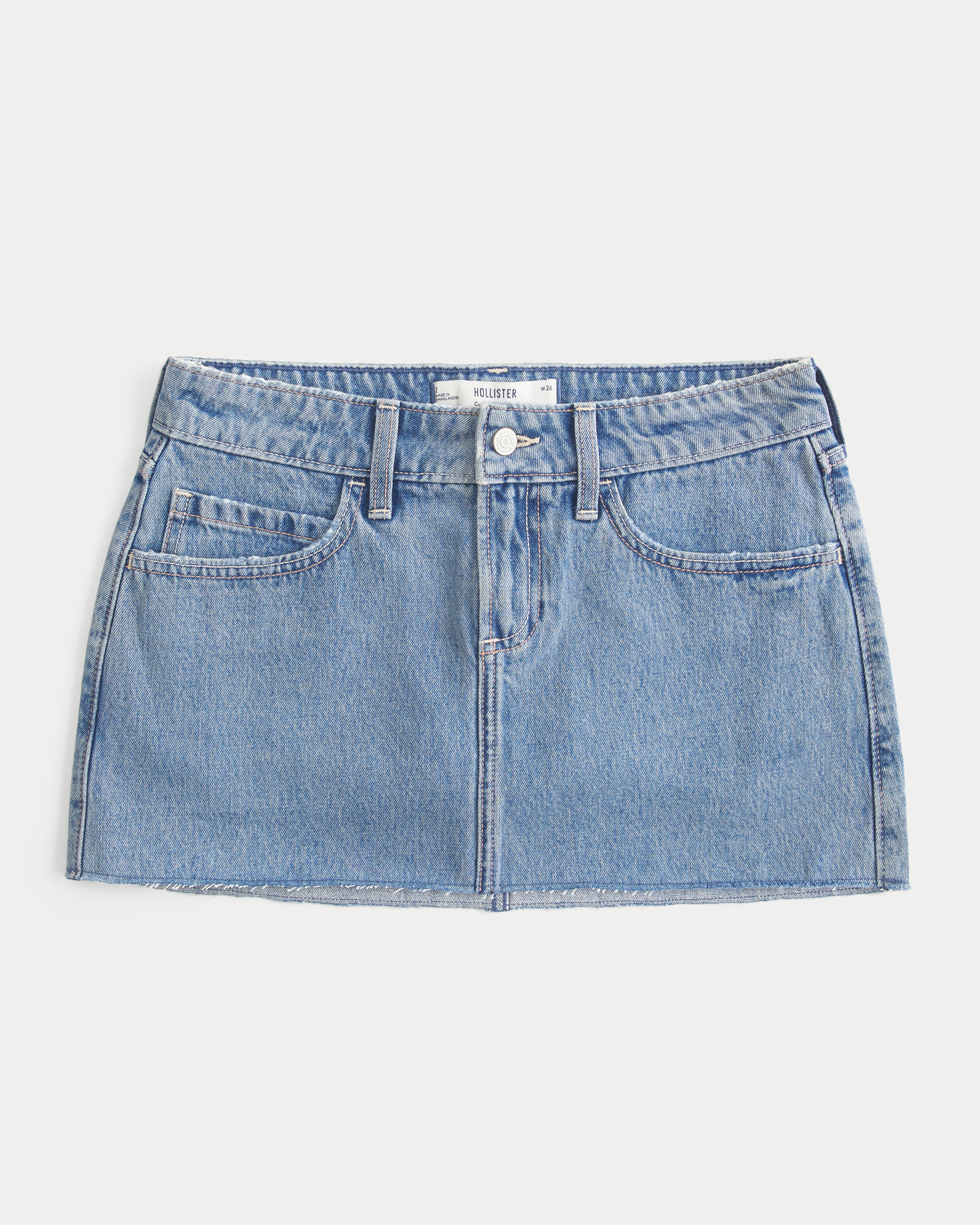 Женская юбка-шорты Hollister Curvy Low-Rise Medium Wash Denim Mini Skort, цвет: Средний — фото 1