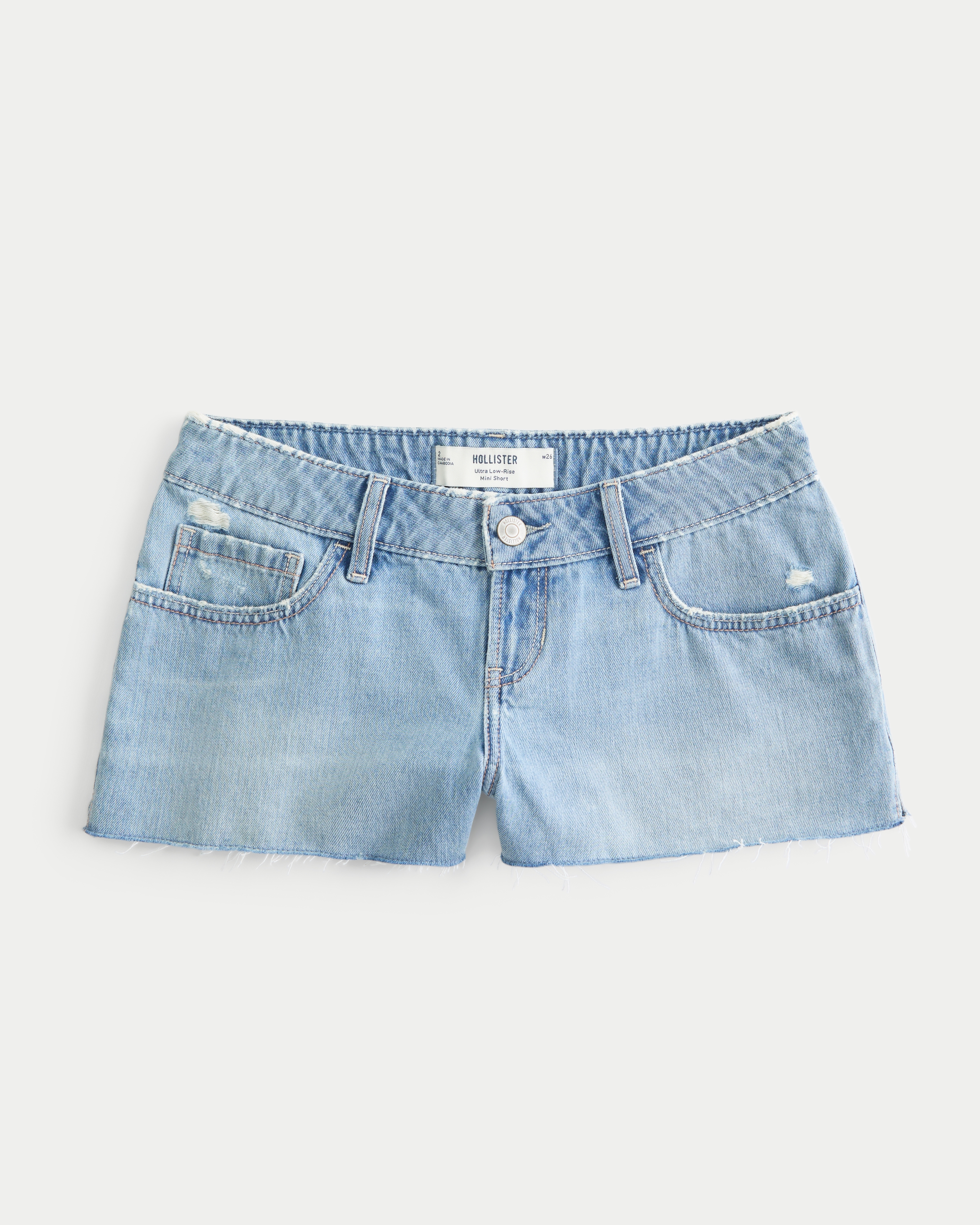 Женские шорты Hollister Ultra Low-Rise Ripped Medium Wash Mini Denim Shorts, цвет: Средняя варка — фото 1